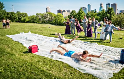  Bride and Groom and Bridal Party cheer on the Slip N Sliders 