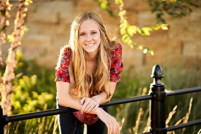 Sun kissed backlight, lights the hair of this beautiful high school senior