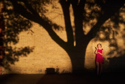 Senior Portrait in the shadows Downtown Chaska Minnesota