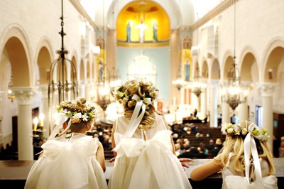 Wedding Picture of Flower Girls Looking Down At Wedding in Church