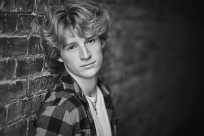 Natural light black and white senior portrait headshot.