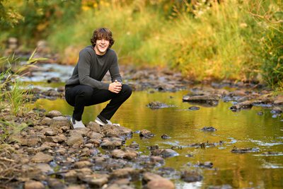 Minnetonka High School Senior along the creek near his home