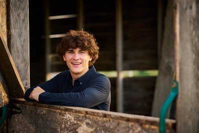 Great smile and headshot in the old barn at sunset