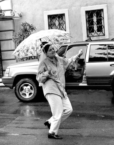 B&W Bride Dancing In The Rain With Joy