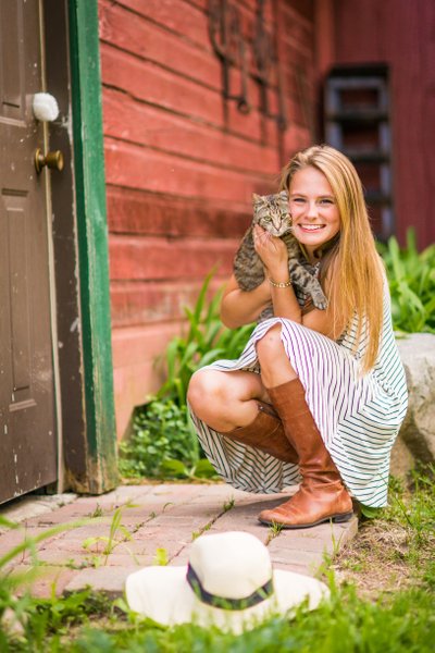 Senior Portrait Of A Female with A cat On t A Farm in Orono Minnesota