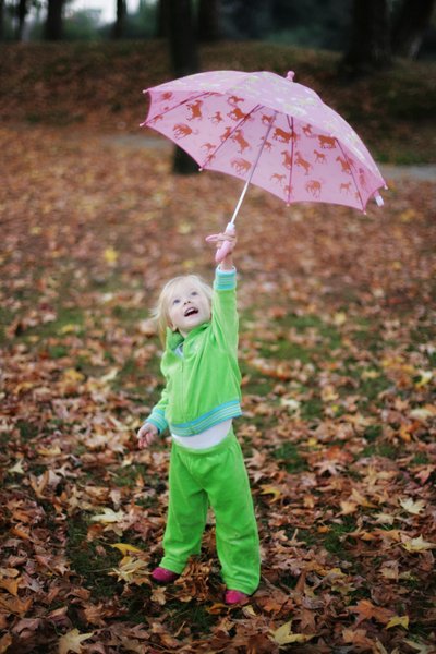 Girl playing with umbrella