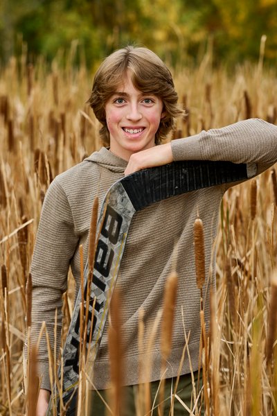 Hockey goalie senior portrait in a marsh Minnetonka Minnesota