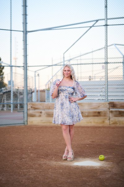 Softball senior portrait with softball bat Wayzata MN.