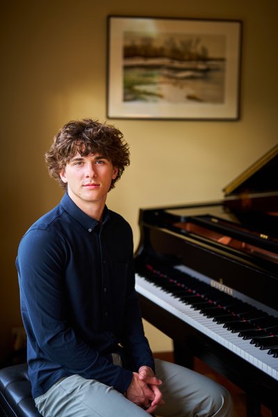 A portrait of a high school senior seated at his piano Excelsior Minnesota