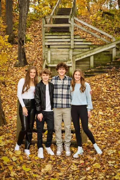 Brothers and Sisters Near Wooden Staircase