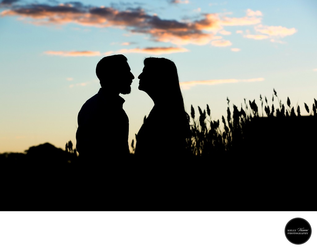 Silhouette Sunset Engagement Session in a field