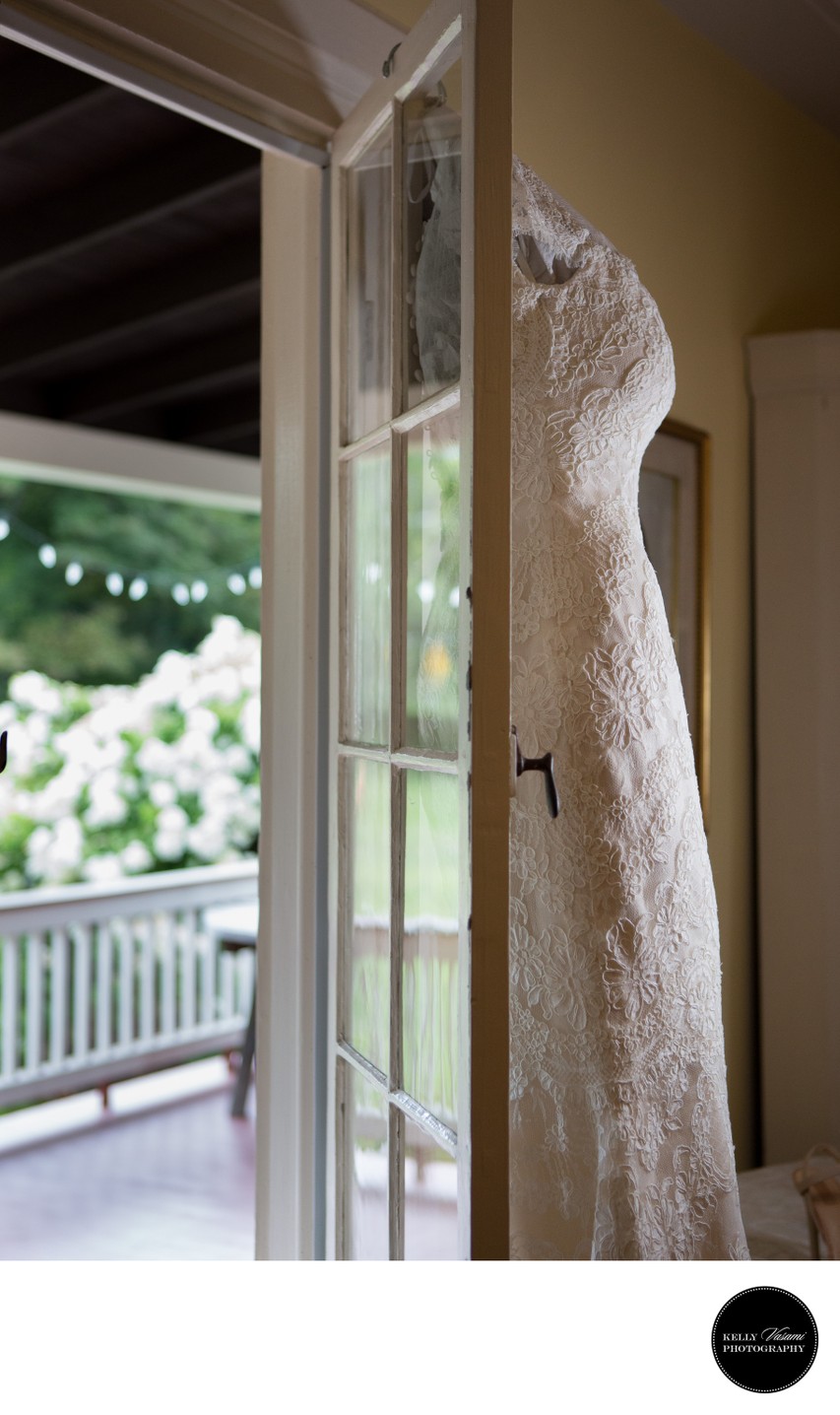Bridal Gown hanging in Doorway | Farmhouse Wedding