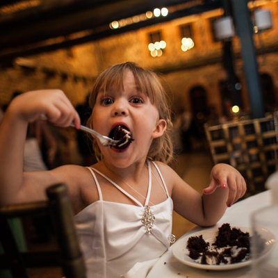 Funny Kids Photo at Wedding | Flower Girl Eating Cake