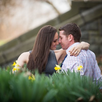 Couple Sitting Among Daffodils | Engagement Session