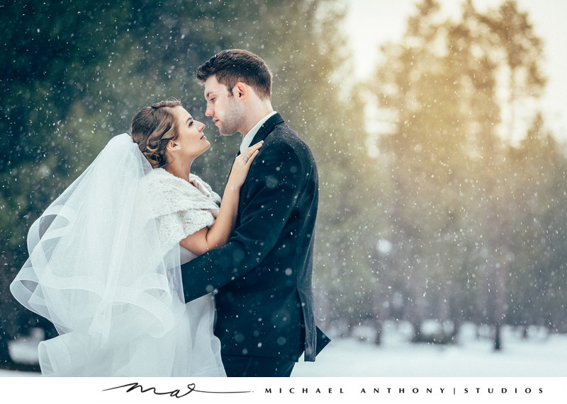 Bride and Groom Posing in Snow