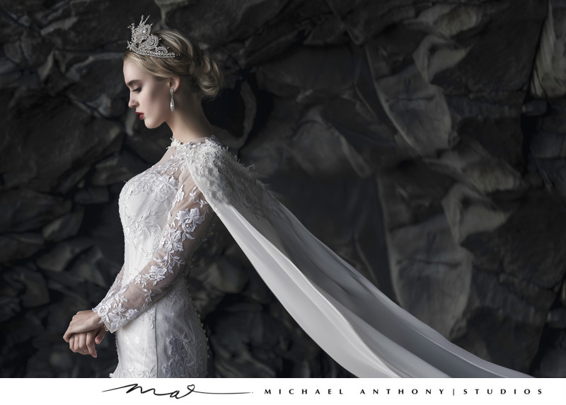 Regal Bride standing in Icelandic Cave