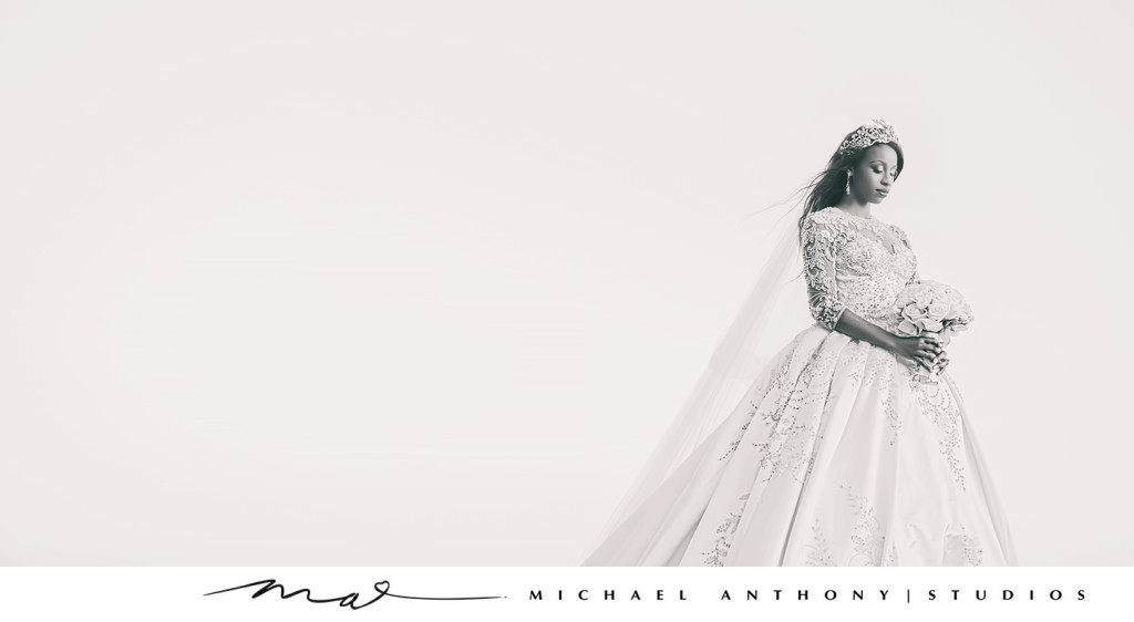 Bride poses against sky in Black and White Portrait