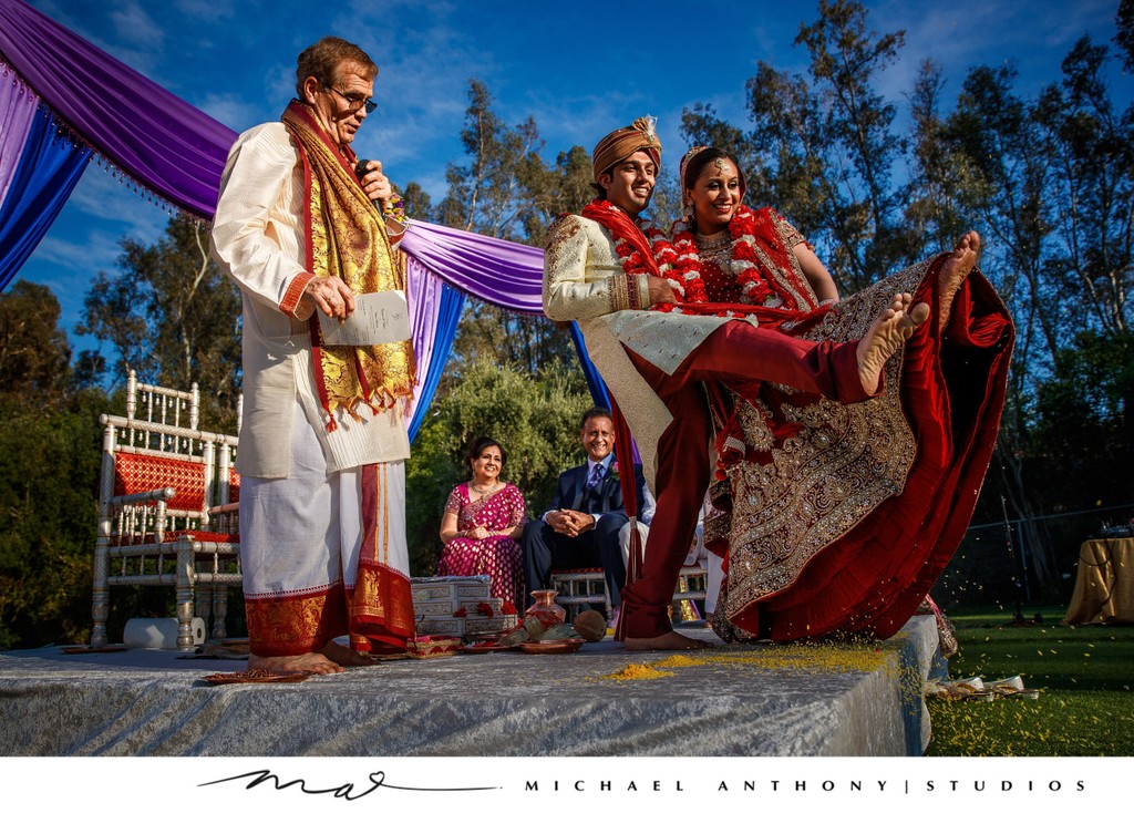 Indian Couple Kicking Rice During Akshata at Wedding