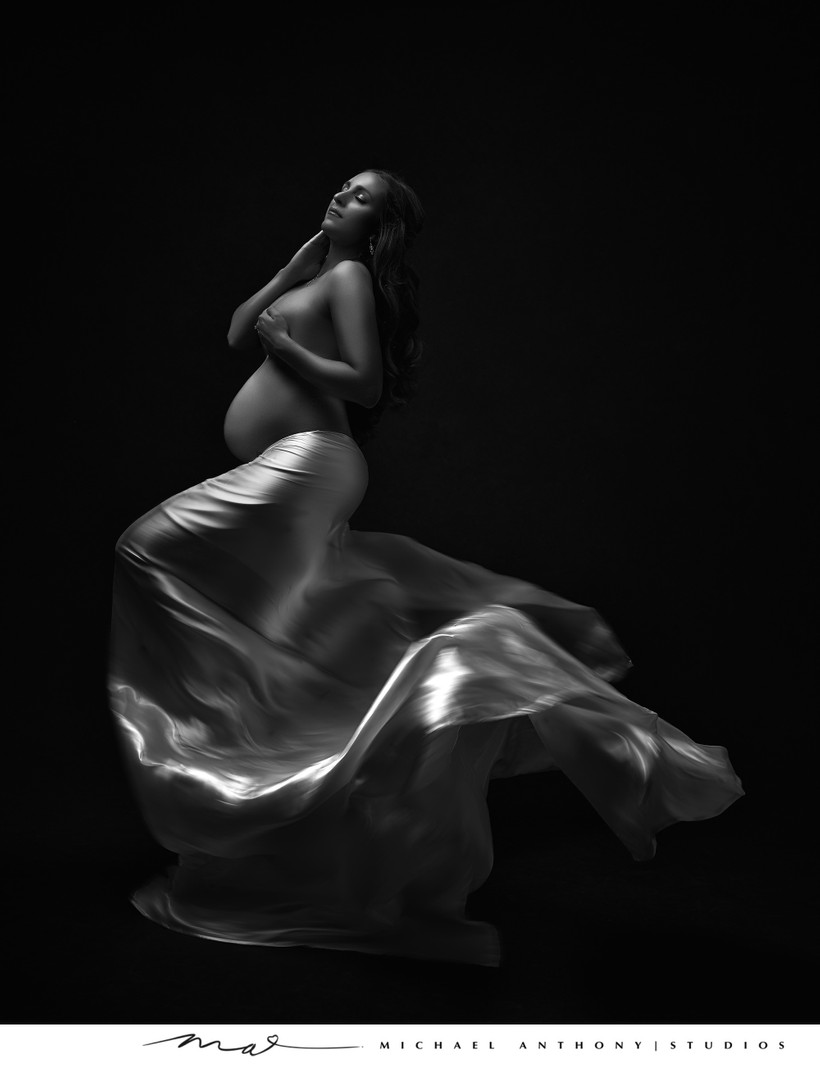 Dramatic Black and White Maternity Portrait with Flowing Silk