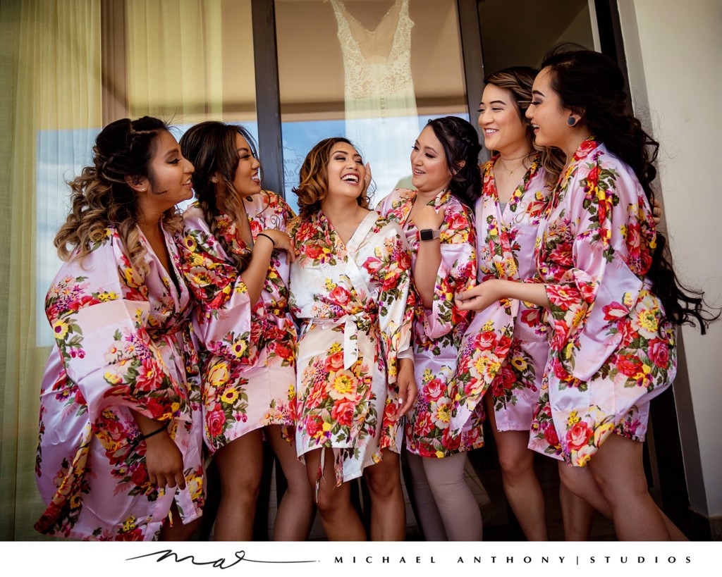 Bridesmaids Sharing a Joyful Moment in Floral Robes