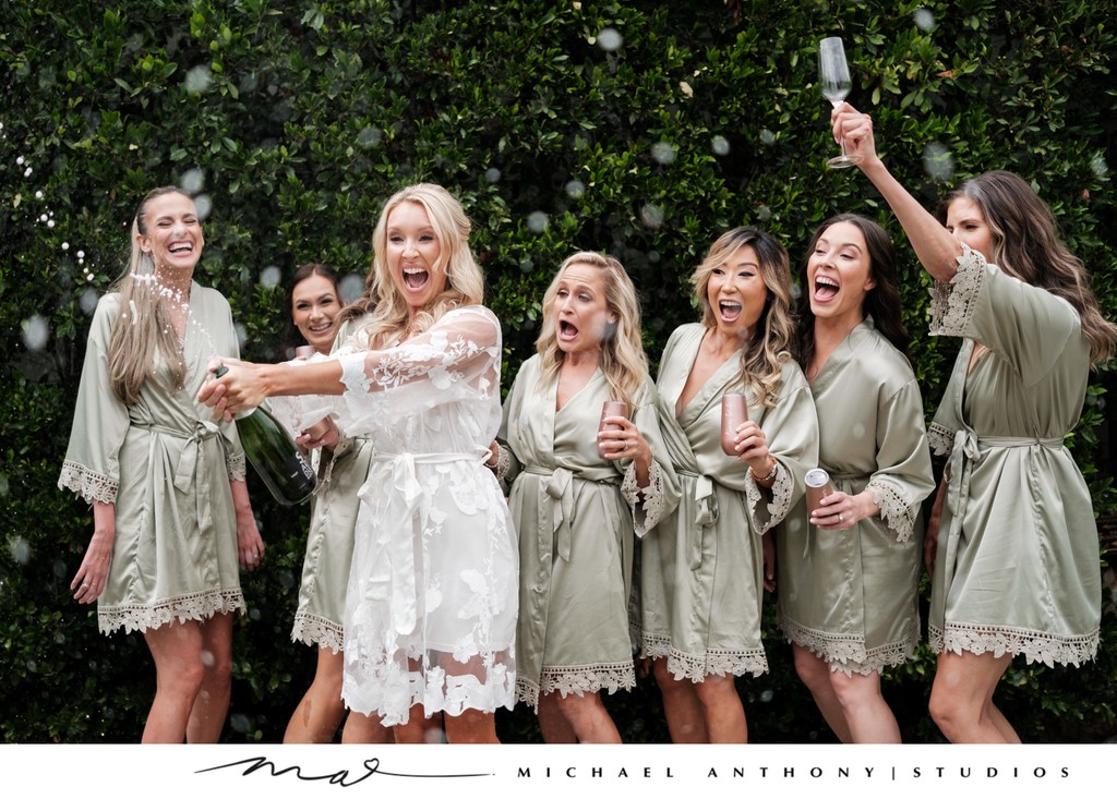 Bride and Bridesmaids Celebrating with Champagne