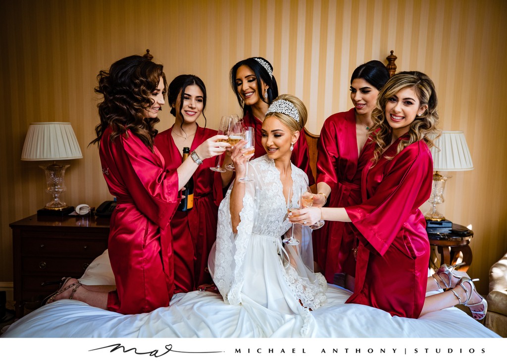 Bride and Bridesmaids Toasting in Red Robes