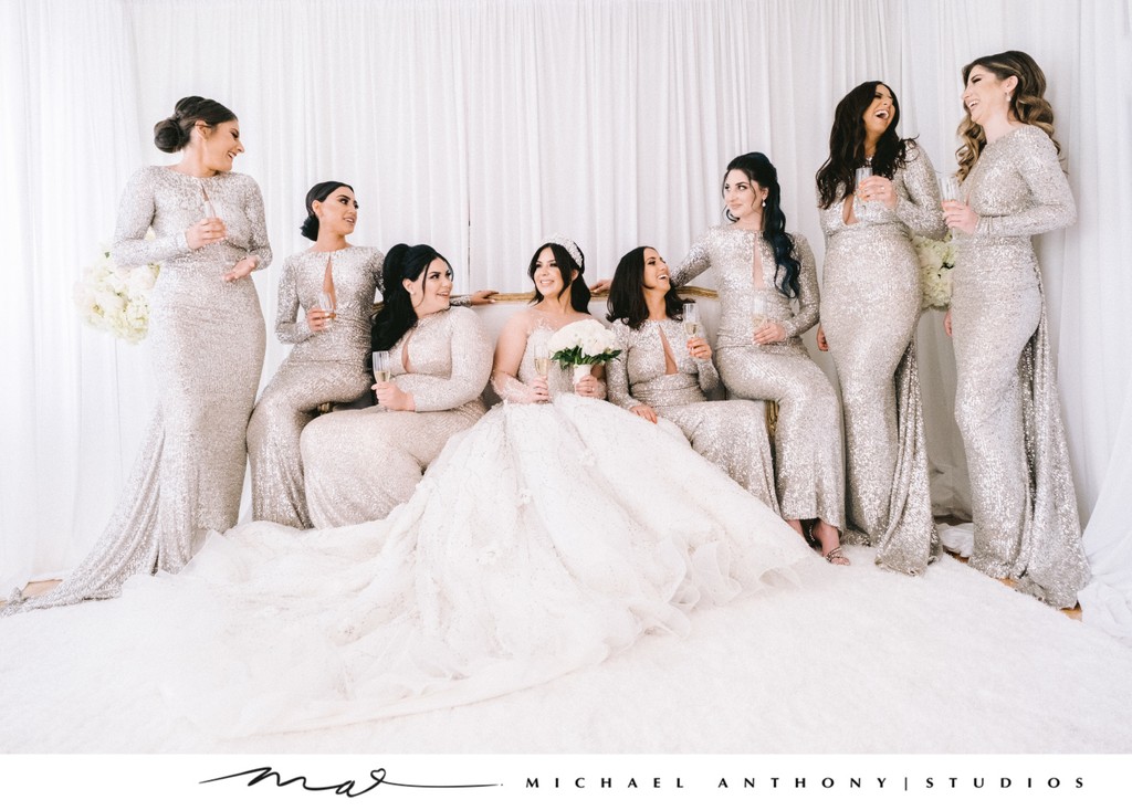 Bridal Party in Silver Gowns Celebrates with Champagne