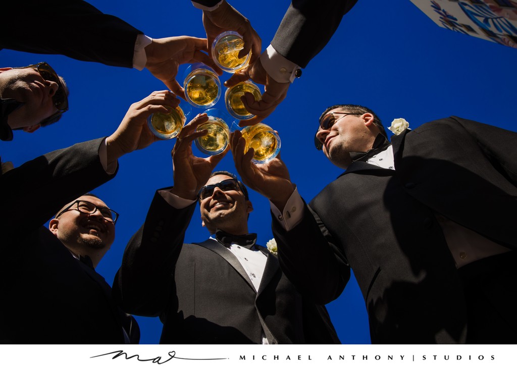 Groomsmen Toasting Under a Clear Blue Sky