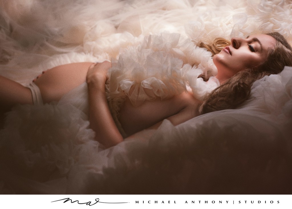 Soft and Dreamy Maternity Portrait with Feathers