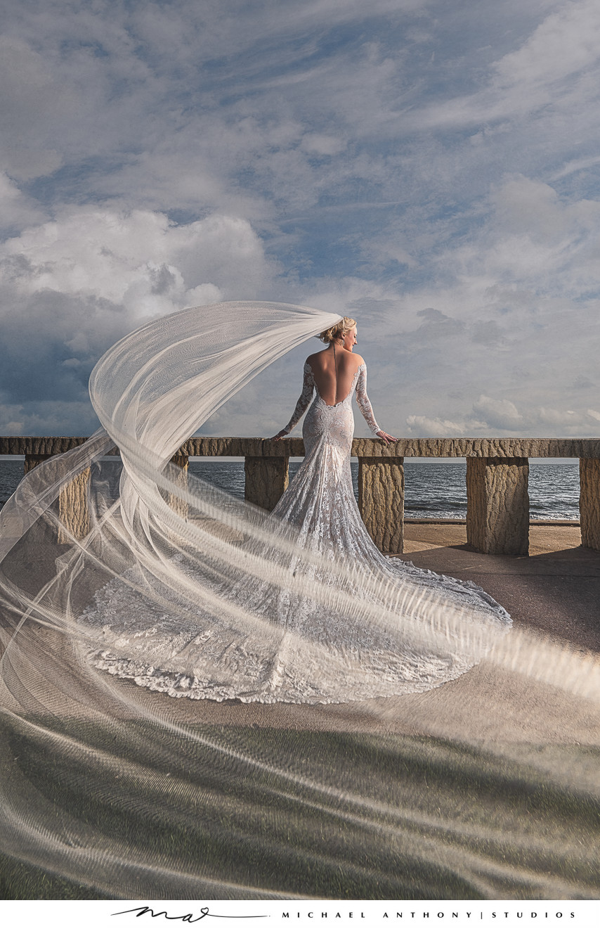 Bride at Beach with Veil Flowing