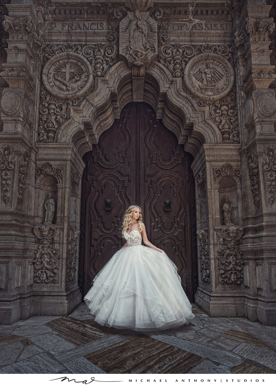 Bride standing in front of Cathedral Doors