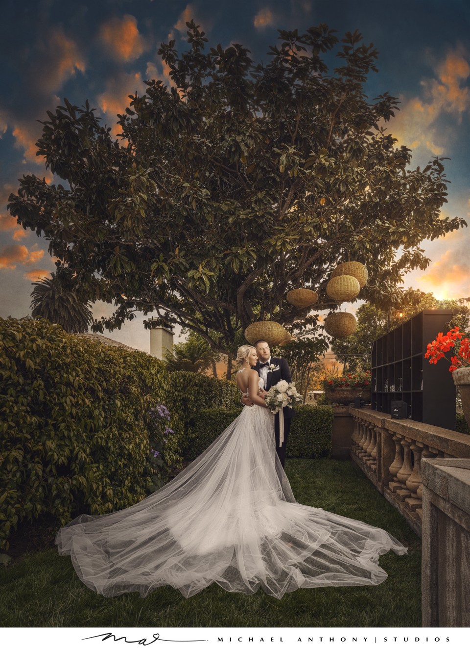 Bride and Goom Posing at Sunset Under a Tree