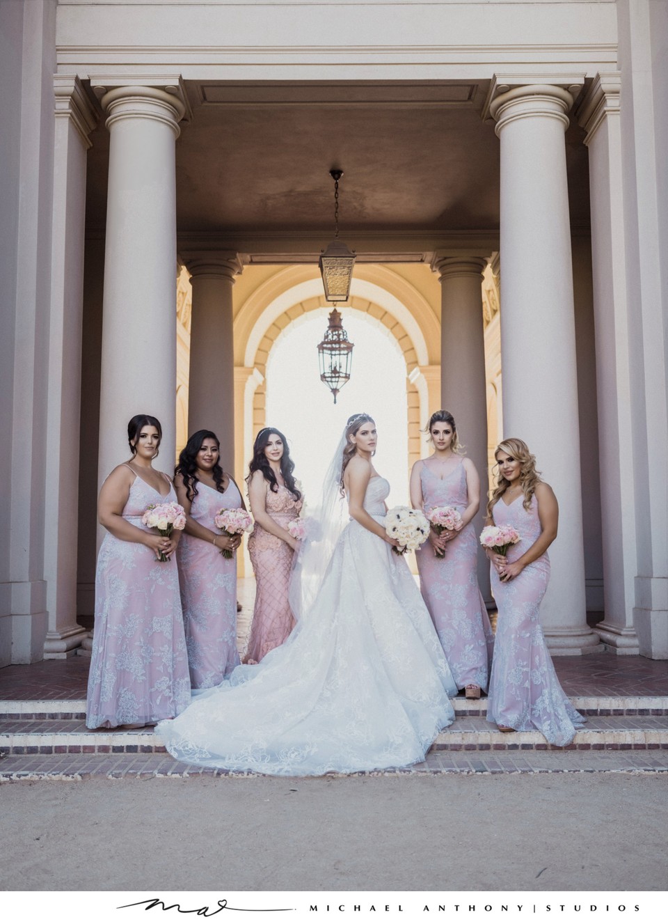 Elegant Bride with Bridesmaids in Soft Pink Dresses