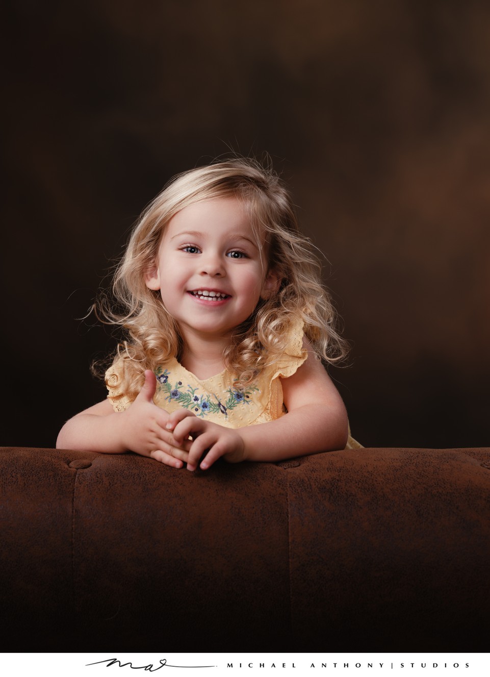 Joyful Little Girl in Yellow Dress Portrait