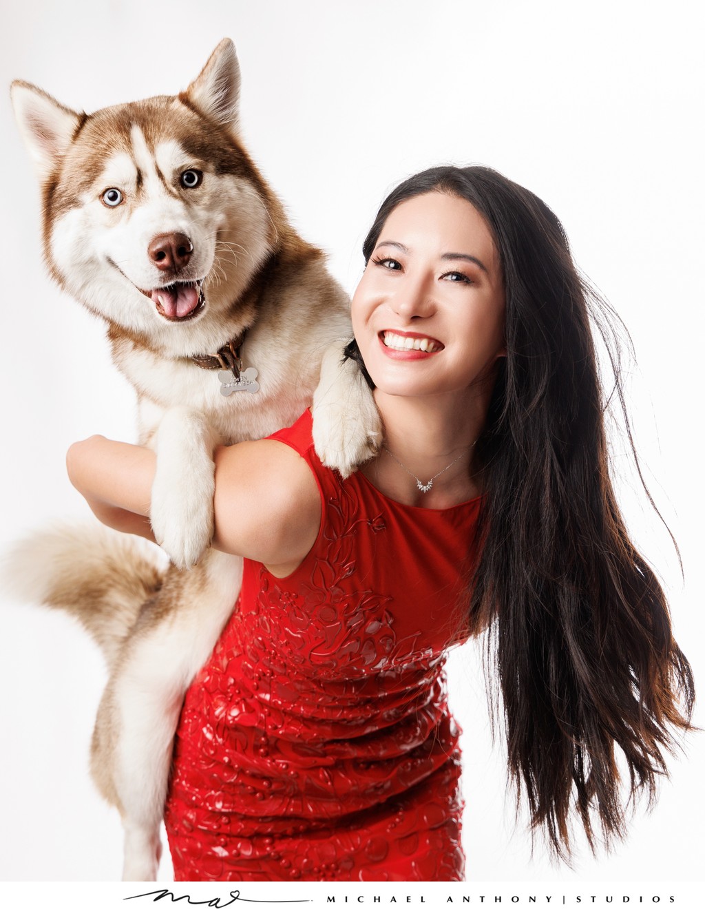 Joyful Husky and Owner Portrait in Red Dress