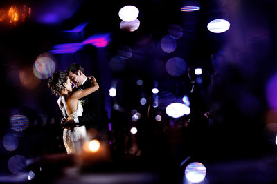 Creative First Dance Photo of Bride and Groom Embracing
