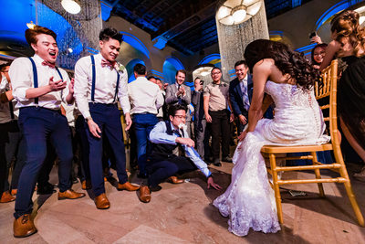 Fun Images of a Garter Toss at Majestic Downtown Wedding