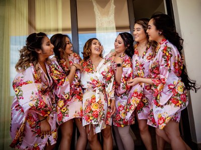 Bridesmaids Sharing a Joyful Moment in Floral Robes