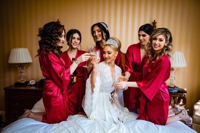 Bride and Bridesmaids Toasting in Red Robes