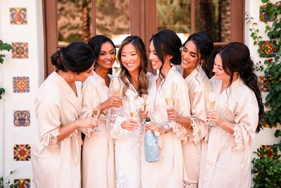 Bridesmaids Sharing a Toast in Matching Robes