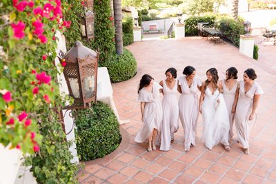 Bride and Bridesmaids Strolling Together