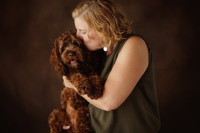 Woman Kissing Dog Portrait