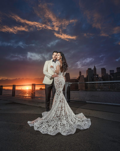 Couple posing in city at sunset