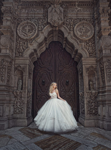 Bride standing in front of Cathedral Doors