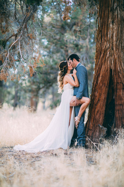 Bride and Groom embrace in the Forest