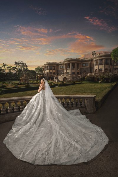 Pasadena Bride with stunning train in front of mansion