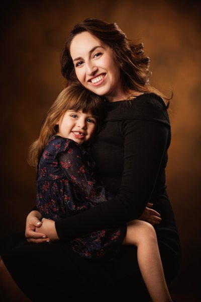 Mother and Daughter Embrace in Dallas Studio Portrait
