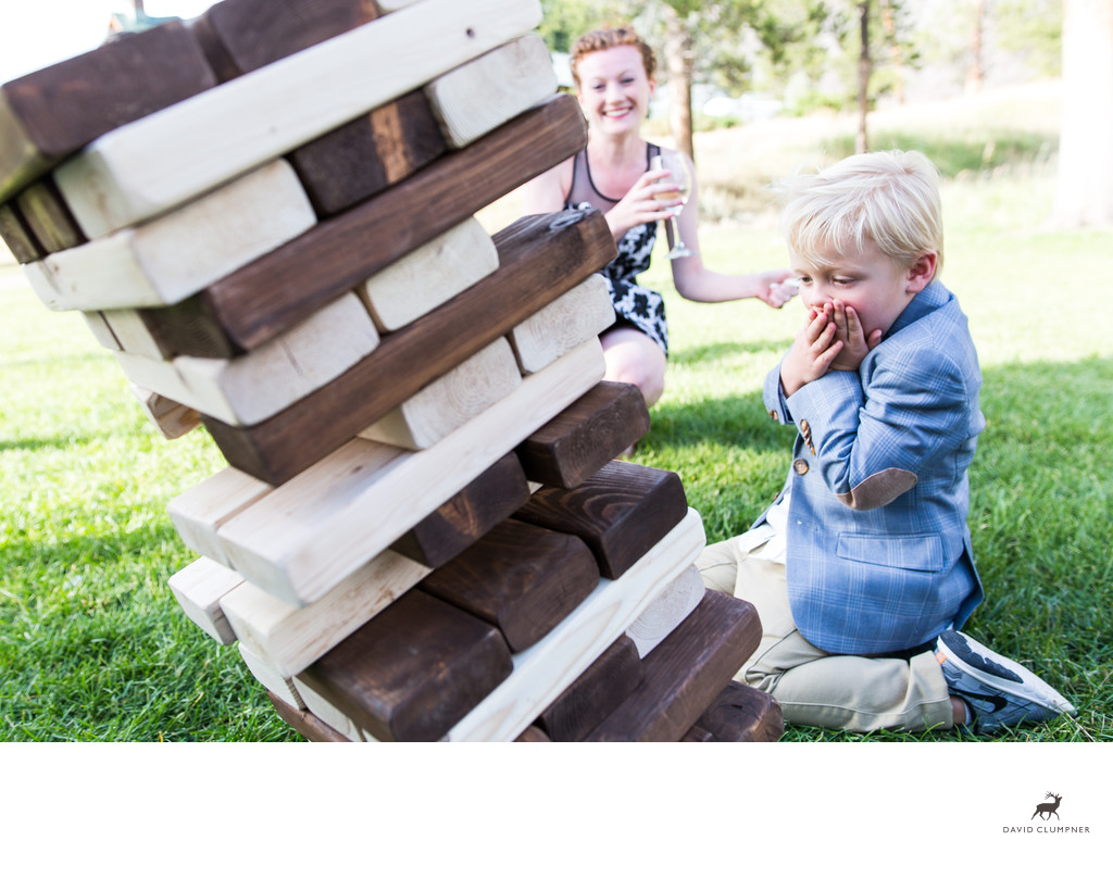 Boy Topples Jenga Game at 320 Guest Ranch in Montana