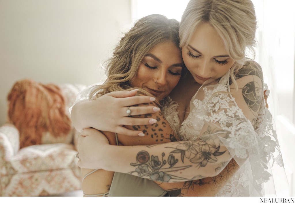 Brides Intimate Embrace with her Bridesmaid