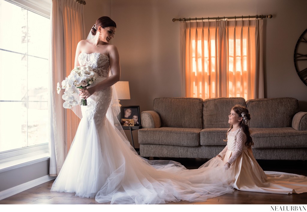 Flower girl helping bride get ready